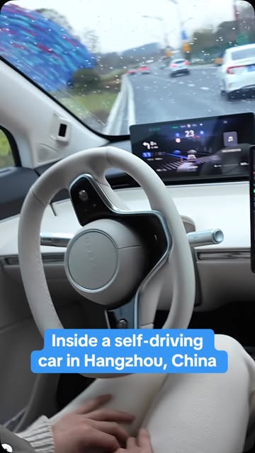#Autonomousvehicles Reel by @cbsnews (verified account) - CBS News' @anna.coren rode in the backseat of a self-driving car in Hangzhou, China, as it navigated multiple lanes, traffic and highways. These home-