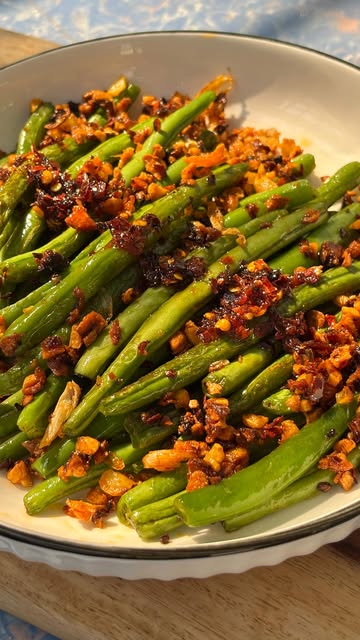 #Chinese Style Green Beans Reel by @polosjunkjournal (verified account) - Chinese Garlic Green Beans 🧄
Recipe:
-Cut the edges of the beans and shallow fry them till bright green and shiny (this usually takes 3 to 4 minute