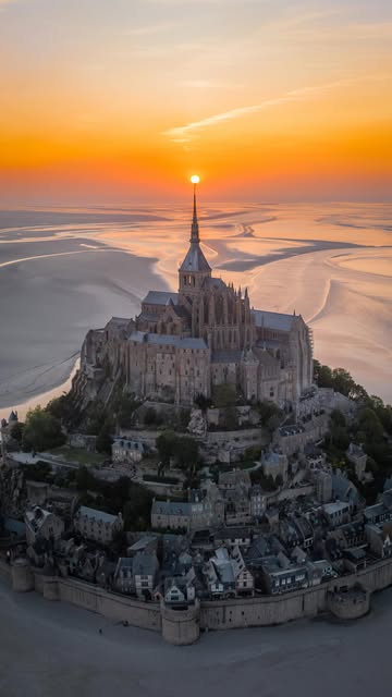 #Travel Reel by @mark_burstein (verified account) - A bucket list place you NEED to experience 🤯
This is Le Mont Saint-Michel, a fortified island village in Normandy, France 🇫🇷
My friend and I fin