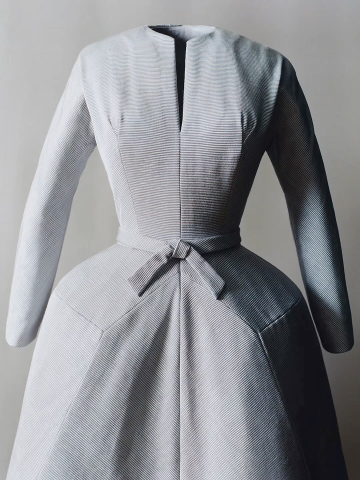 From the archives - an original dress, miniature toile and documentation of the eponymous Autumn Winter 1952-1953 design whose architectural form inspired the new Dior Cigale bag by Jonathan Anderson.